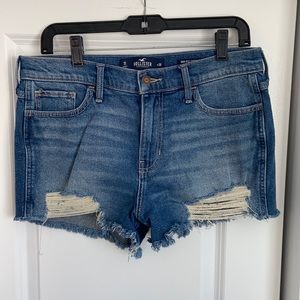 Distressed denim shorts.